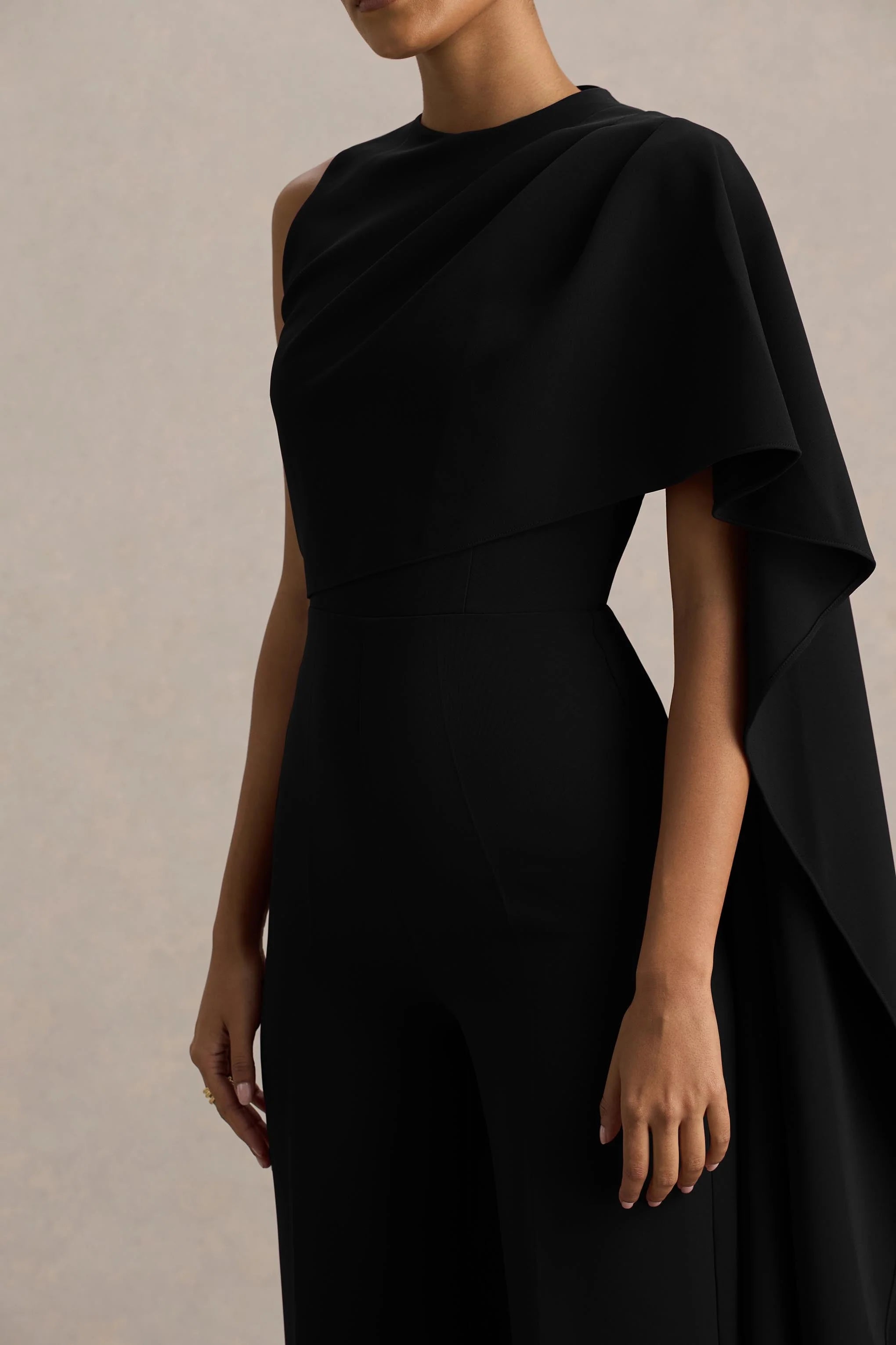 Sorenia Black High Neck Jumpsuit With One Cape Sleeve